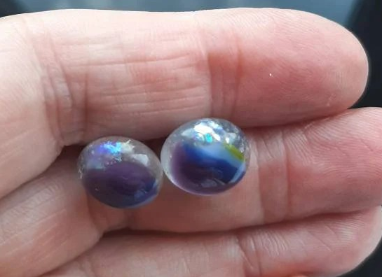 One of a kind, purple, blue, green and clear dichroic rainbow glass studs. One of a kind, purple, blue, green and clear dichroic rainbow glass studs.