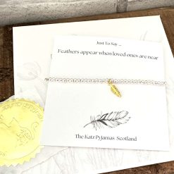 "Just To Say ... Feathers appear. Beaded stretchy bracelet. Gold Feather charm