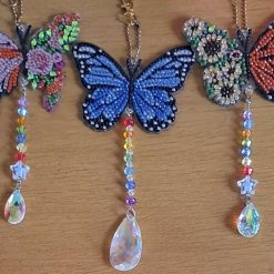 Diamond painted butterfly suncatchers