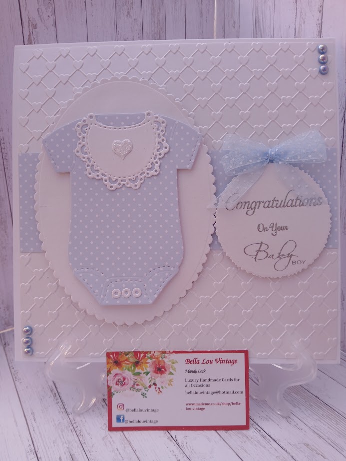 Luxury Handmade Baby Boy - Congratulations on your Baby Boy - White & blue onesie with embossed heart background Luxury Handmade Baby Boy - Congratulations on your Baby Boy - White & blue onesie with embossed heart background