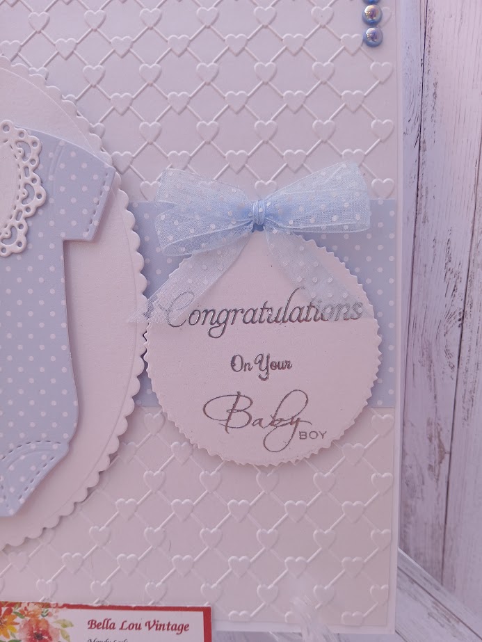 Luxury Handmade Baby Boy - Congratulations on your Baby Boy - White & blue onesie with embossed heart background Luxury Handmade Baby Boy - Congratulations on your Baby Boy - White & blue onesie with embossed heart background