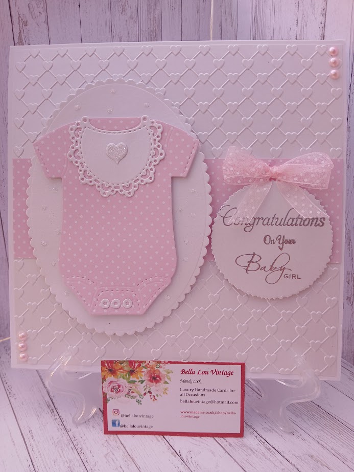 Luxury Handmade Baby Girl - Congratulations on your Baby Girl - White & pink onesie with embossed heart background Luxury Handmade Baby Girl - Congratulations on your Baby Girl - White & pink onesie with embossed heart background
