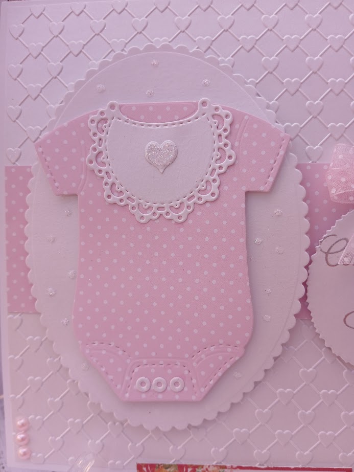 Luxury Handmade Baby Girl - Congratulations on your Baby Girl - White & pink onesie with embossed heart background Luxury Handmade Baby Girl - Congratulations on your Baby Girl - White & pink onesie with embossed heart background