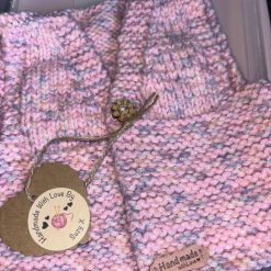 Hand knitted waistcoat baby shower gift