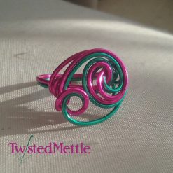 Turquoise and fuscia coloured copper ring. 381