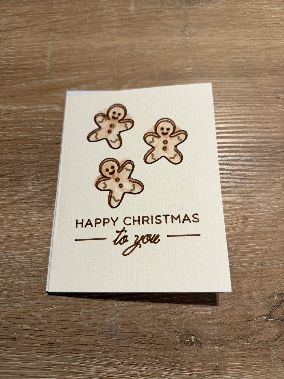 Handmade Watercolour Christmas Card with Gingerbread Men Design Handmade Watercolour Christmas Card with Gingerbread Men Design