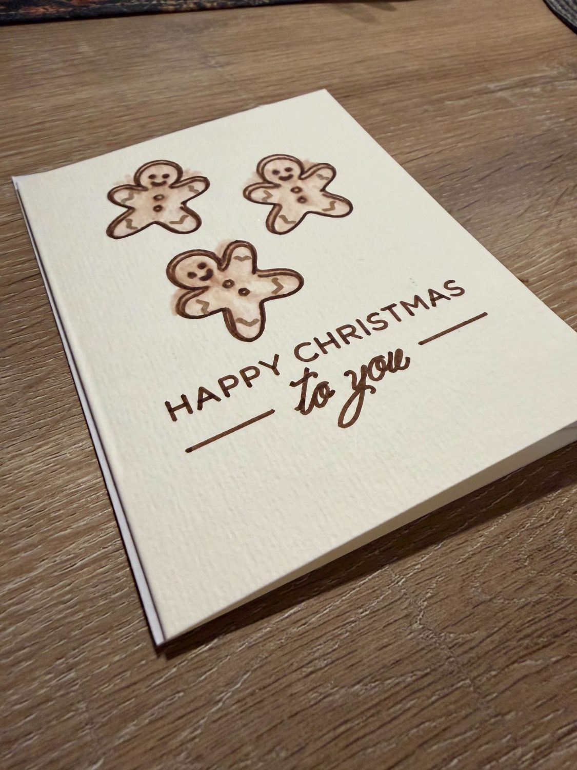 Handmade Watercolour Christmas Card with Gingerbread Men Design Handmade Watercolour Christmas Card with Gingerbread Men Design