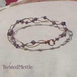 Copper and lilac coloured copper open plait bracelet with amethyst beads