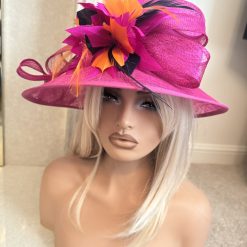 Fuchsia pink formal hat with orange and purple accents