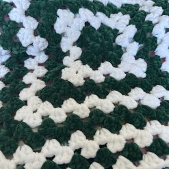 Small crochet blanket in green/white