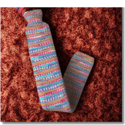Extra long hot water bottle with handcrafted knitted cover - yarn design Thelma