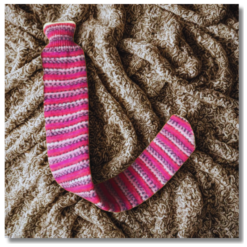 Extra long hot water bottle with handcrafted knitted cover - yarn design Claire