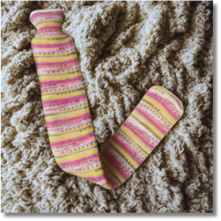 Extra long hot water bottle with handcrafted knitted cover - yarn design Princess