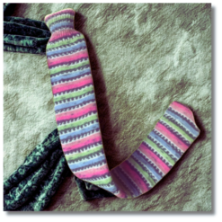 Extra long hot water bottle with handcrafted knitted cover - yarn design Sunny