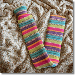 Extra long hot water bottle with handcrafted knitted cover - yarn design Sweet Pea