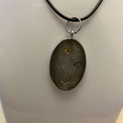 Oval pendent with butterflies