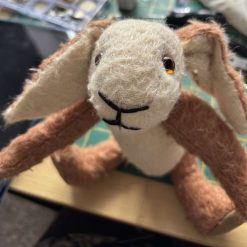 Hand knitted squirrel soft toy
