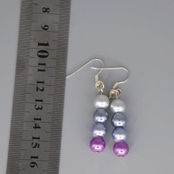This is a purple and cream beaded earrings length 29mm width 8mm 2