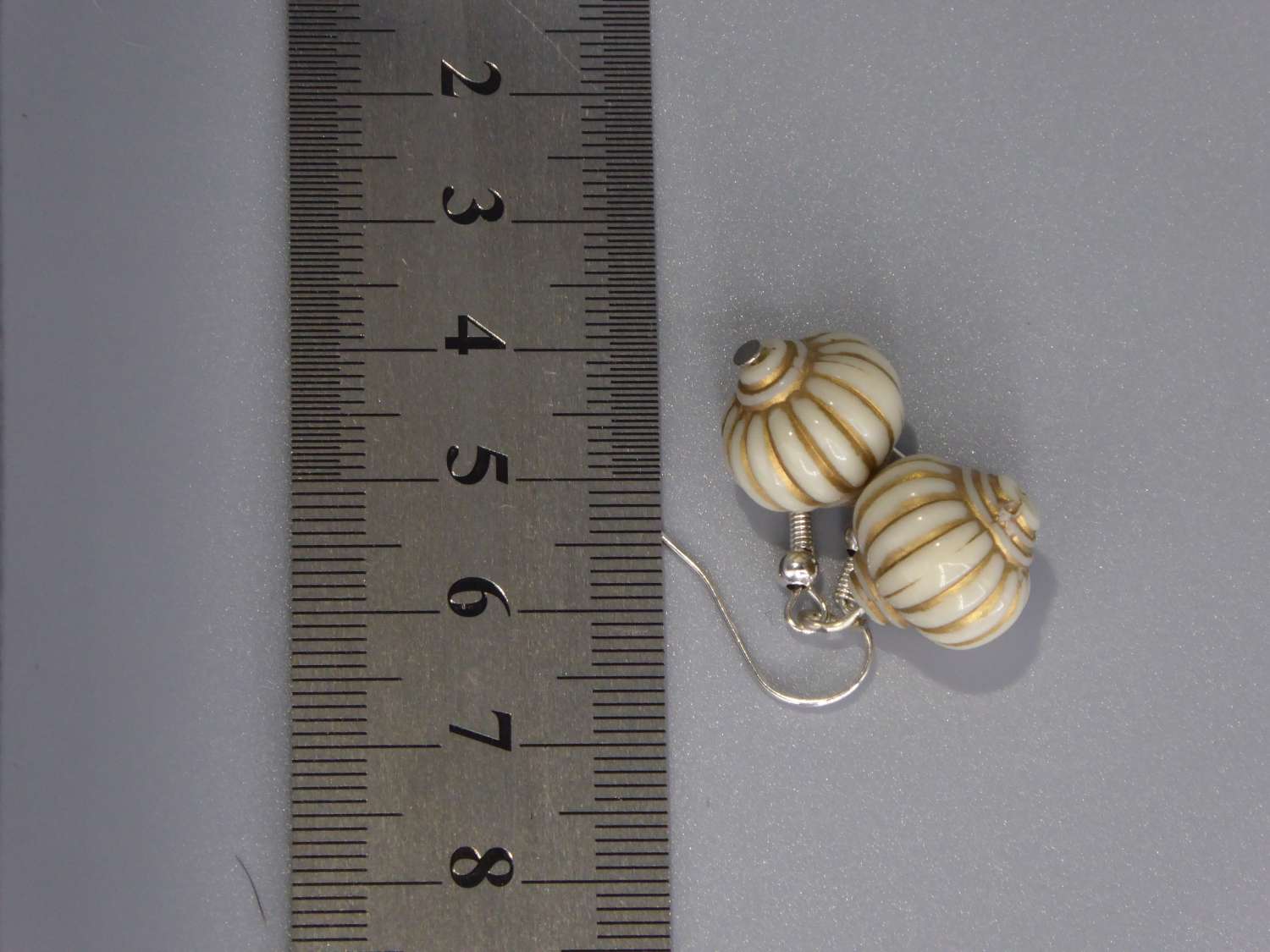 cream and gold lantern-style drop earrings. length 17mm width 13mm cream and gold lantern-style drop earrings. length 17mm width 13mm