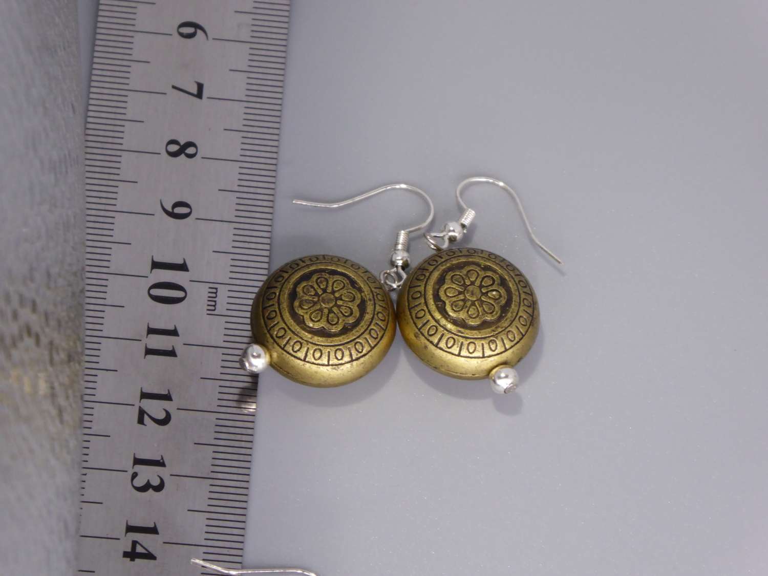 tribal yellow gold-plated earrings . length 19mm width 19mm tribal yellow gold-plated earrings . length 19mm width 19mm