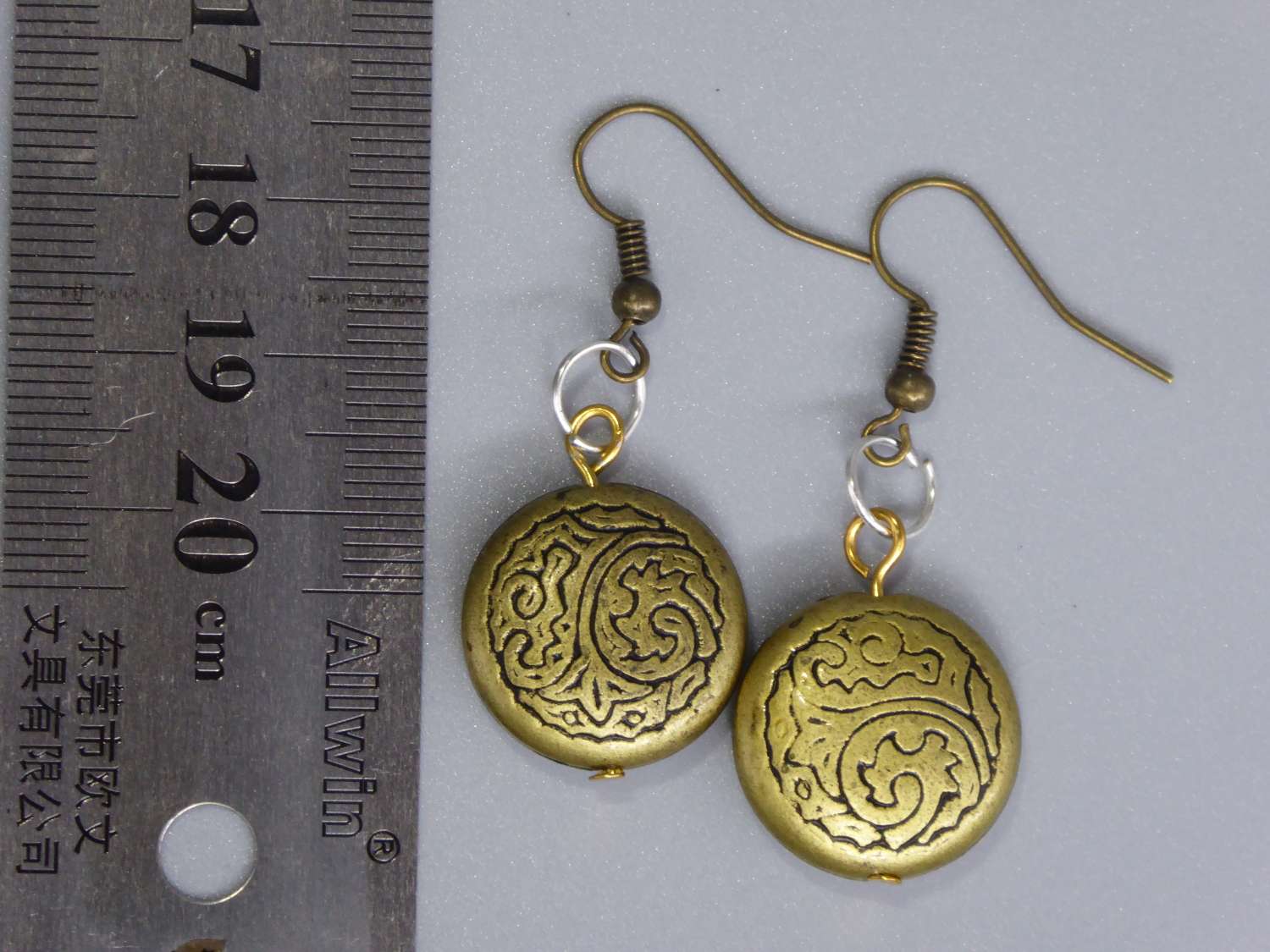 tribal yellow gold-plated earrings . length 19mm width 19mm tribal yellow gold-plated earrings . length 19mm width 19mm