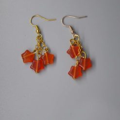 orange star dangle earrings length 29 mm width 29 mm