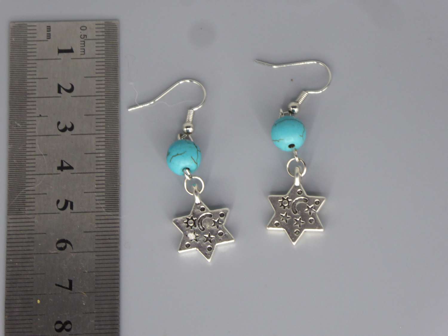 Celestial Dangle with Turquoise Colored Bead earrings length 37mm width 12mm Celestial Dangle with Turquoise Colored Bead earrings length 37mm width 12mm