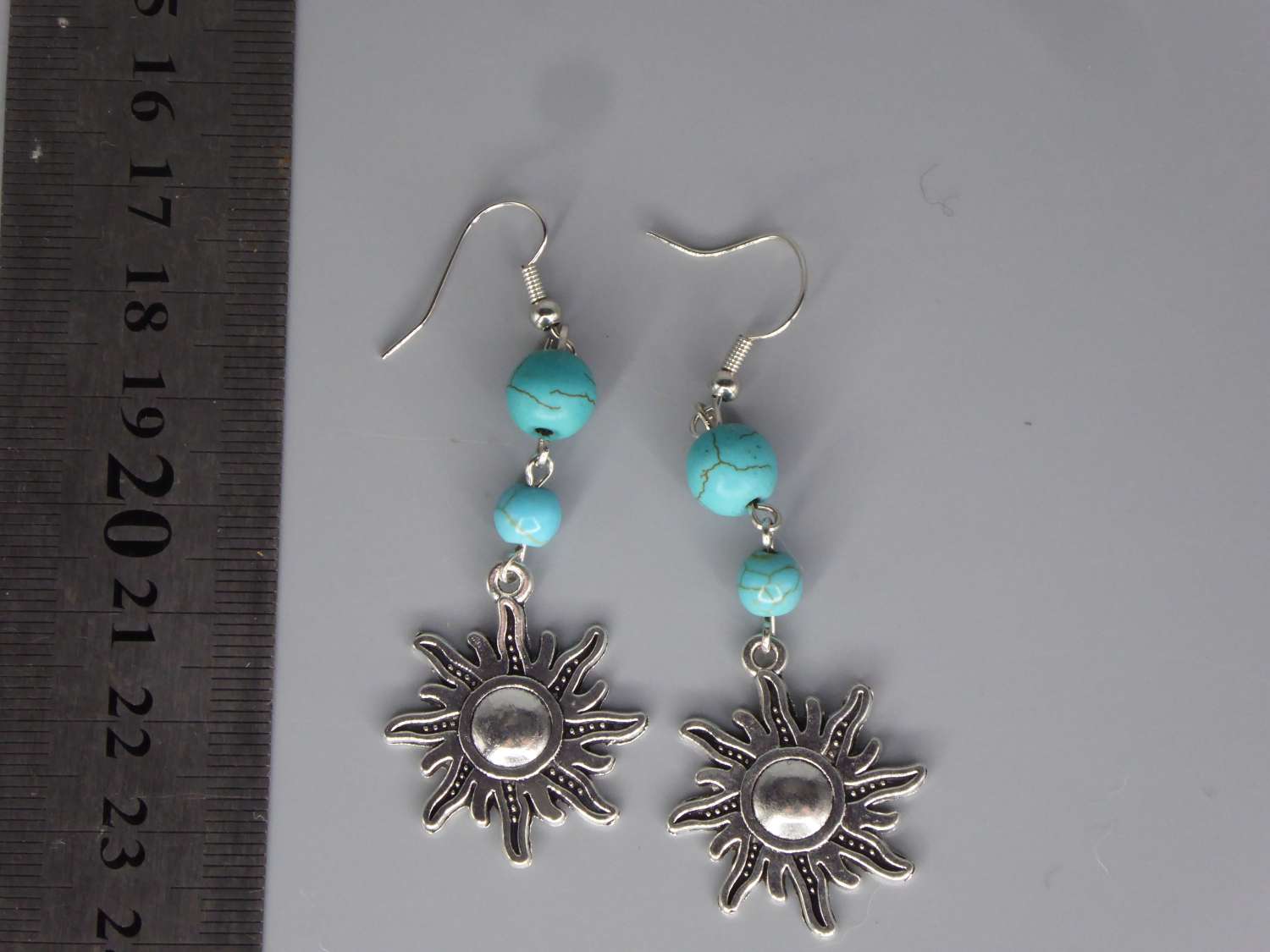 Celestial Dangle with Turquoise Colored Bead earrings length 64mm width 24m Celestial Dangle with Turquoise Colored Bead earrings length 64mm width 24m