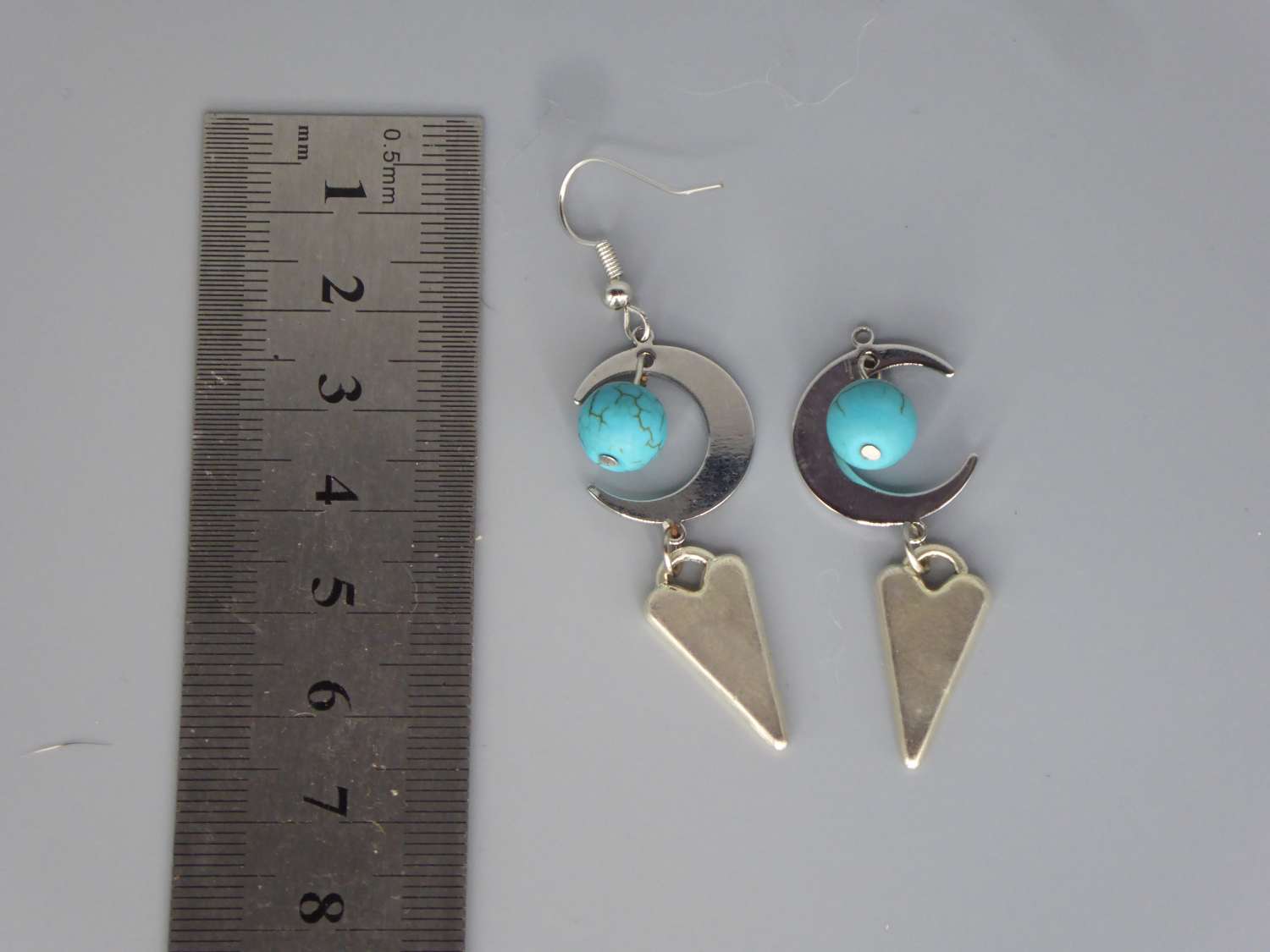 Celestial Dangle with Turquoise Colored Bead earrings length 42mm width 18mm Celestial Dangle with Turquoise Colored Bead earrings length 42mm width 18mm