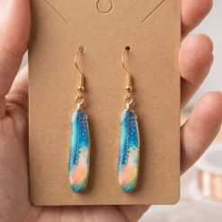Gold feather design earrings