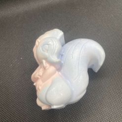 Handmade blue and pink plaster squirrel