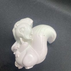 Handmade pink and light green plaster squirrel