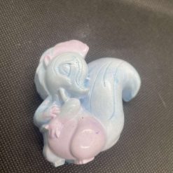 Handmade pink and blue plaster squirrel