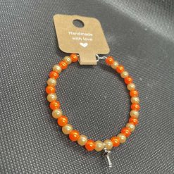 Handmade orange wired bracelet with cross charms