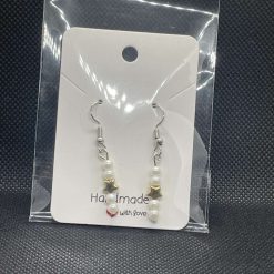 Handmade white beaded and star charmed earrings