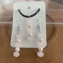 Handmade pink and beige beaded necklace and earring set.