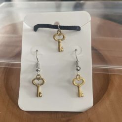 Handmade gold key charm necklace and earring set.