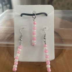 Handmade pink and white beaded necklace and earring set.