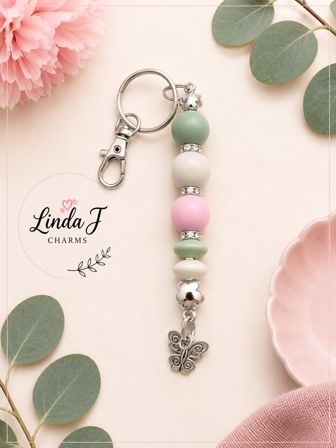 9CB3DEEA-F80E-4AEF-938E-5572A11FDBDD Handmade Pastel Butterfly Beaded Keyring – Sage Green, Pink & Cream 1
