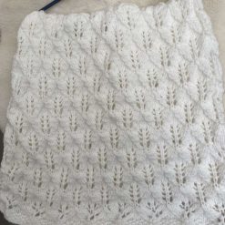 Hand knitted baby cot blanket