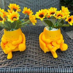 Knitting lady flowerpots