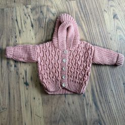 Hand knitted baby cardigan with hood