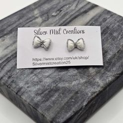 white bow studs
