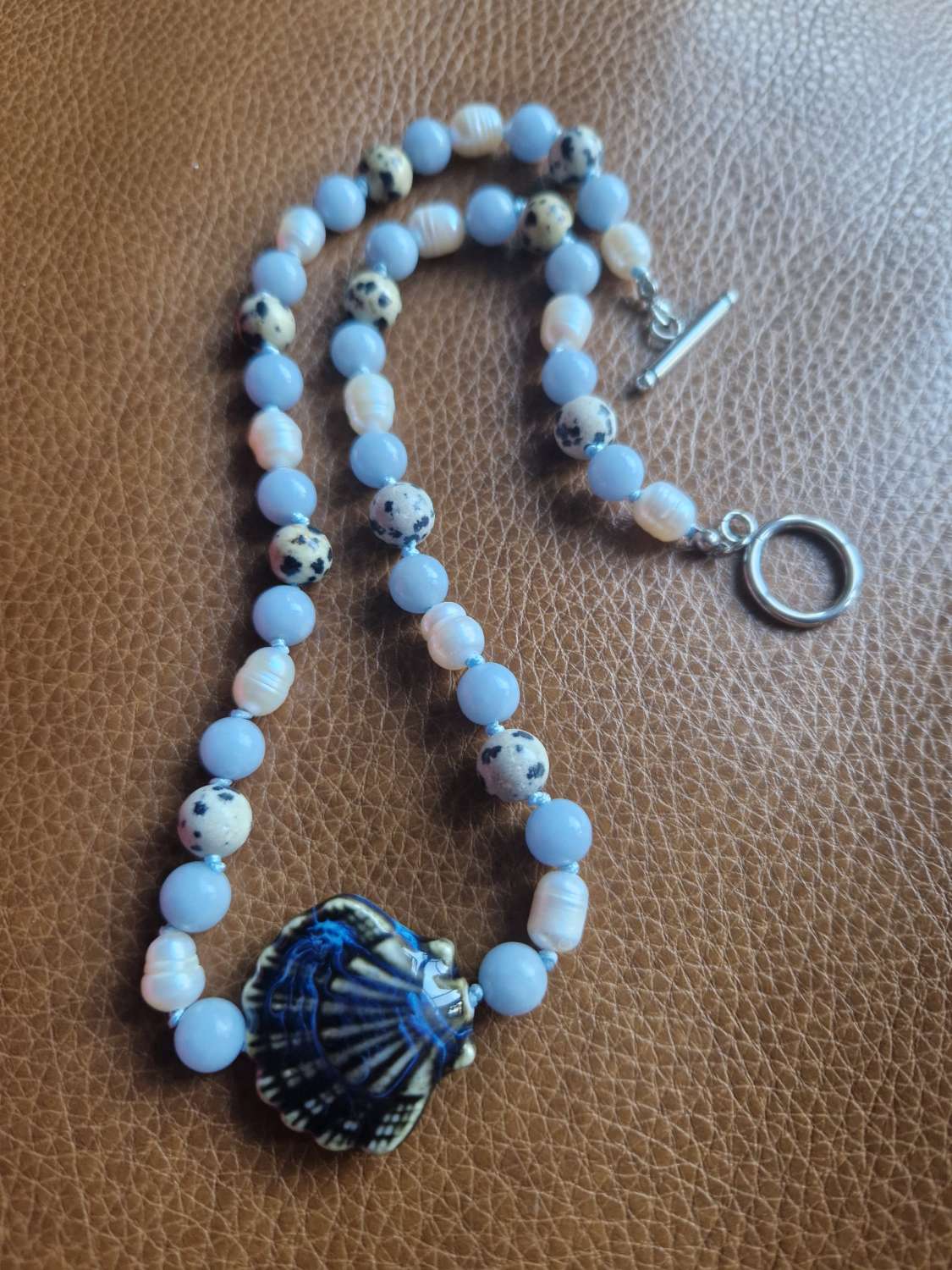 Handmade Dalmation Jasper, Faux Pearls & Angelite beaded necklace with Ceramic Shell Handmade Dalmation Jasper, Faux Pearls & Angelite beaded necklace with Ceramic Shell