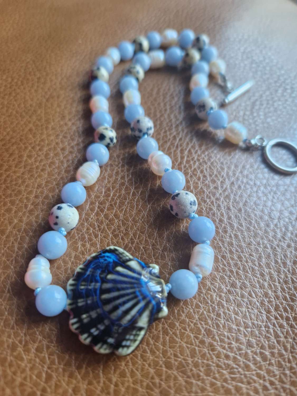 Handmade Dalmation Jasper, Faux Pearls & Angelite beaded necklace with Ceramic Shell Handmade Dalmation Jasper, Faux Pearls & Angelite beaded necklace with Ceramic Shell