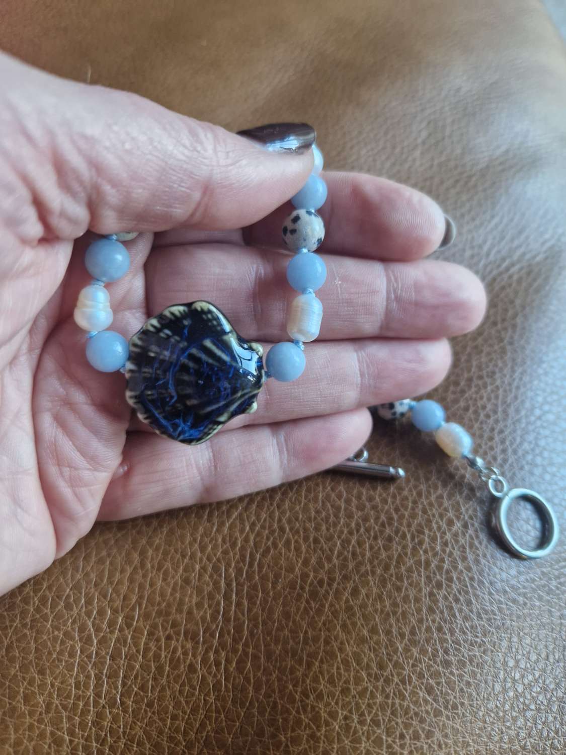 Handmade Dalmation Jasper, Faux Pearls & Angelite beaded necklace with Ceramic Shell Handmade Dalmation Jasper, Faux Pearls & Angelite beaded necklace with Ceramic Shell