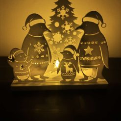 Festive penguin tea light holderder