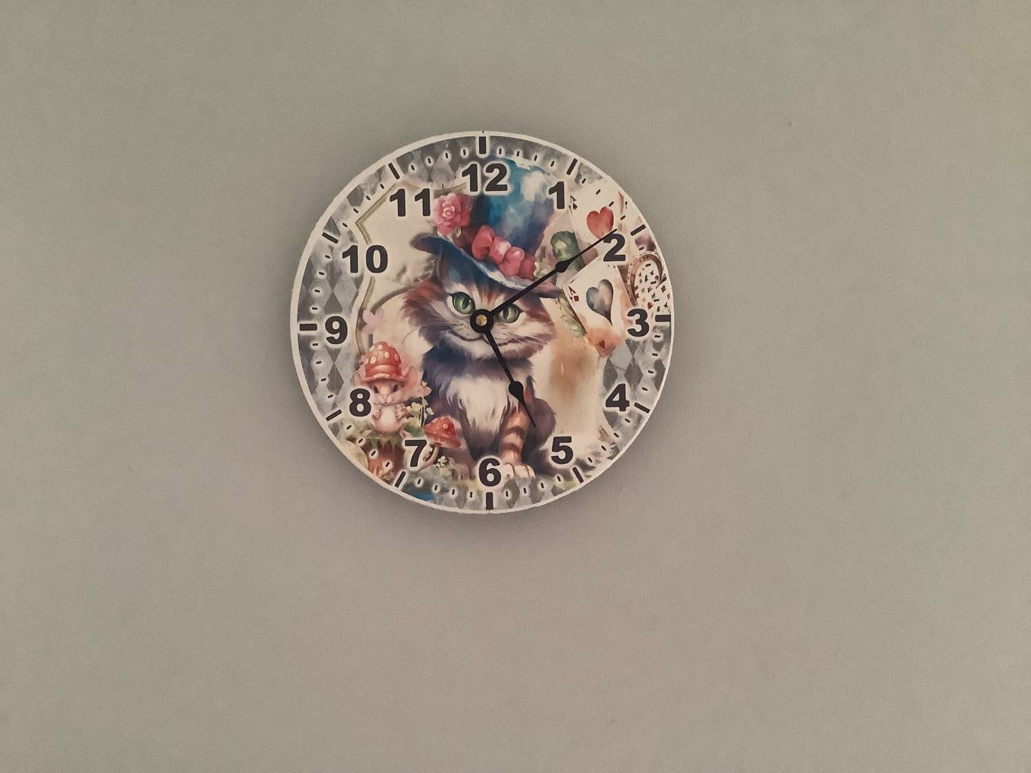 Decoupaged MDF clock using a Cheshire Cat image Decoupaged MDF clock using a Cheshire Cat image