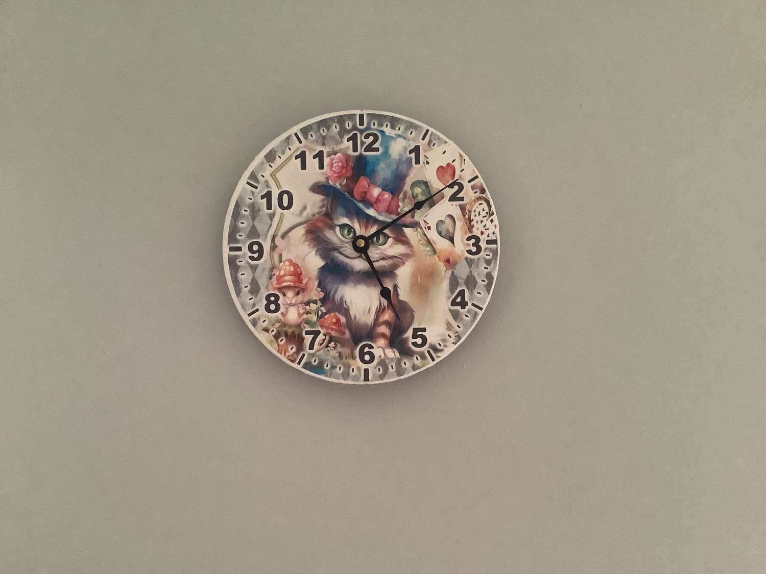 Decoupaged MDF clock using a Cheshire Cat image Decoupaged MDF clock using a Cheshire Cat image