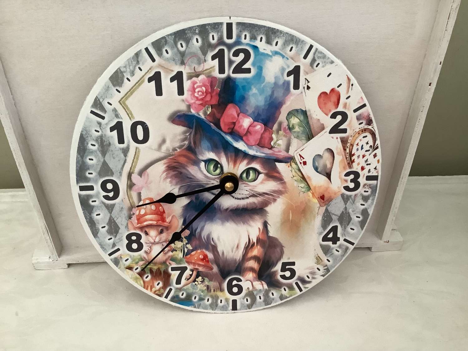 Decoupaged MDF clock using a Cheshire Cat image Decoupaged MDF clock using a Cheshire Cat image